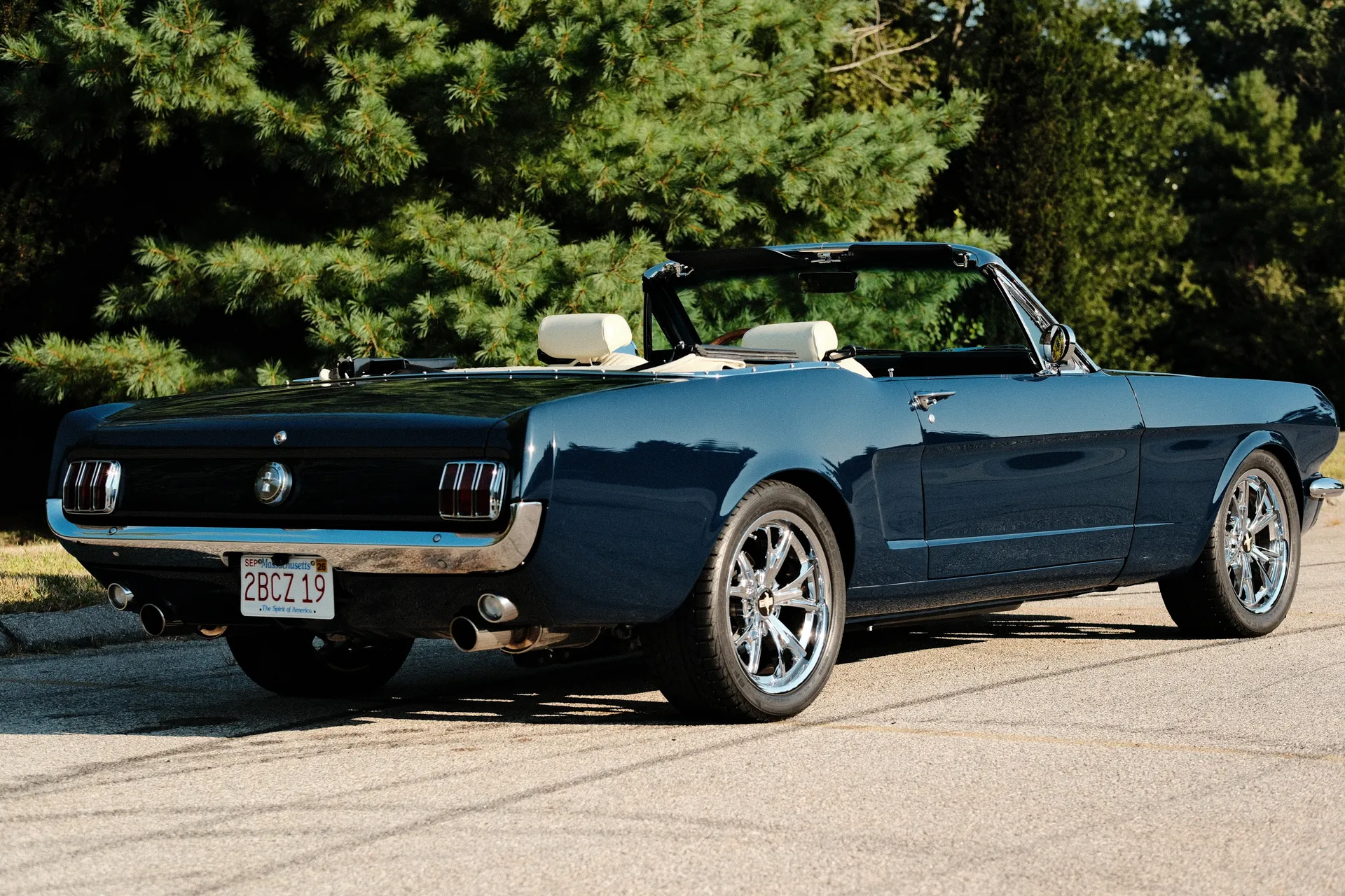 Rear three-quarter view showing the Rhapsody Blue paint